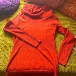 100% Merino wool cowl neck sweater.